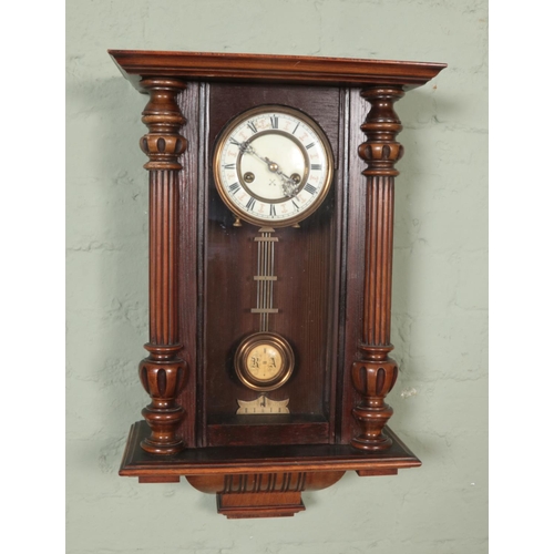 329 - A Hamburg American Clock Co HAC wall clock with turned columns