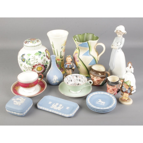 54 - A good collection of ceramics. Includes Nao, Goebel, Fairylite cup of knowledge, Wedgwood, Old Tupto... 