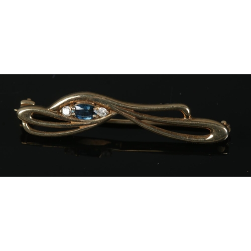 348 - A 9ct gold diamond and sapphire brooch. Total weight 3.06g.