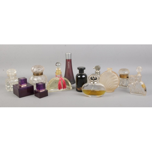 6 - A collection of mainly perfume and scent bottles including cut glass examples and inkwell.