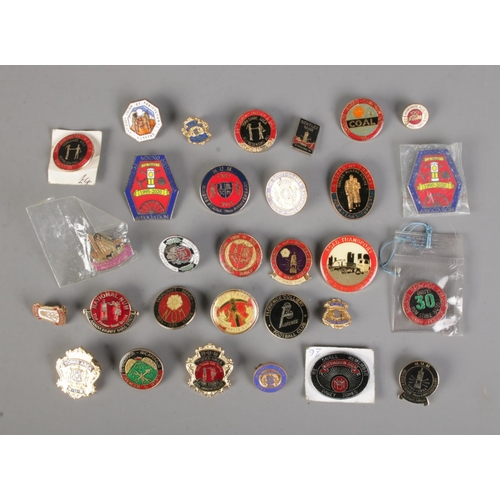 352 - A collection of mostly mining and colliery enamel pin badges to include N.U.M (National Union of Min... 