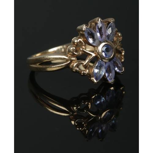 356 - A 9ct Gold Tanzanite floral ring, set with six stones. Stamped 375 and GTV for Gems TV to the inside... 