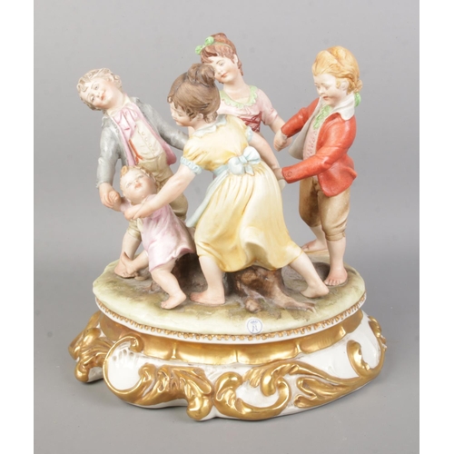 2 - A Capodimonte figure group 'Ring A Roses' depicting children in a circle surrounding a tree trunk. R... 