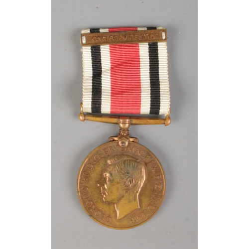 381 - A George V Special Constabulary Long Service Medal, 1951 along with a South Yorkshire Police plaque.... 