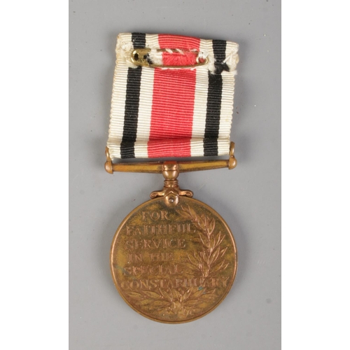 381 - A George V Special Constabulary Long Service Medal, 1951 along with a South Yorkshire Police plaque.... 