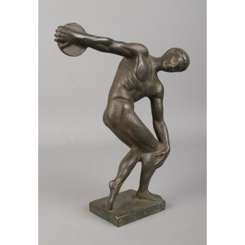 389 - After Myron; a bronze model formed as Discobolus. Height: 18.5cm.