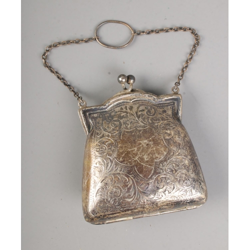 391 - A silver small ladies evening purse with embossed design assayed Birmingham 1917.

Weight 69.7g