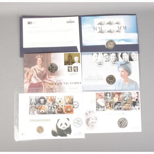 397 - A small quantity of Royal Mint commemorative coin covers to include The Coronation Anniversary crown... 