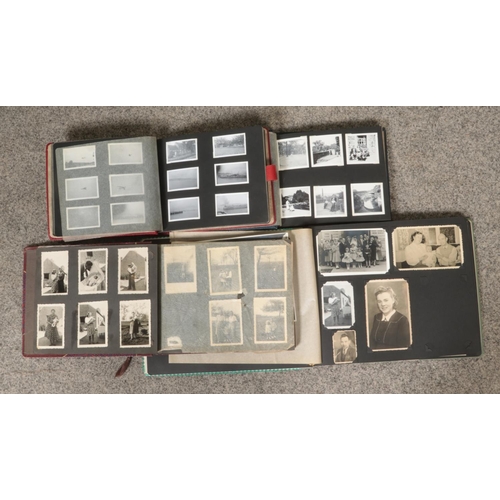 74 - Four vintage photograph albums, containing a collection of photographs, including examples from the ... 