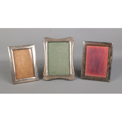 401 - Three silver mounted photograph frames, two assayed for Birmingham, the other for Carr's of Sheffiel... 