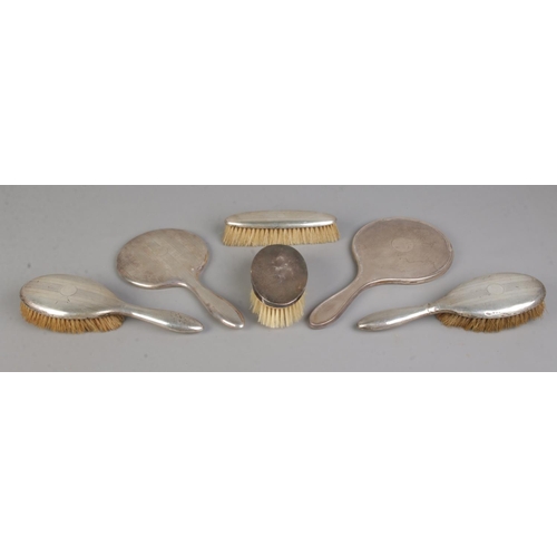 402 - Six silver backed dressing table items, to include a set of four assayed for Birmingham, 1926 by W I... 