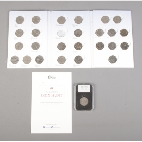 412 - The Royal Mint; A Coin Hunt 50p collection folder featuring circulated coins, alongside a cased circ... 