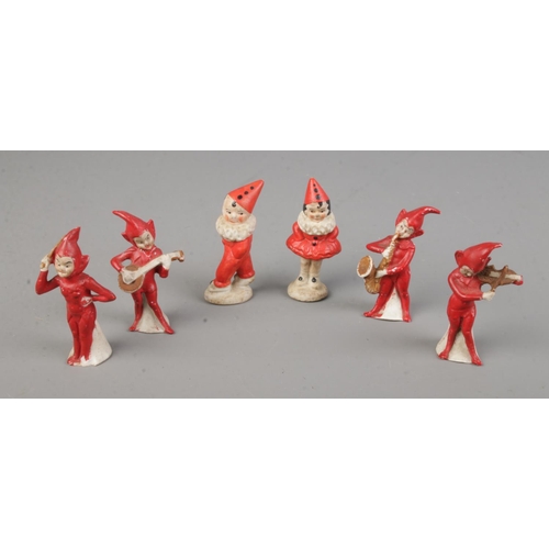 417 - A collection of rare German all bisque novelty cake decorations/ornaments including musicians and je... 