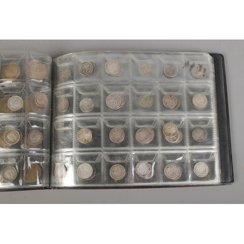 378 - A folder of British pre-decimal coins to include a good quantity of  approx. 38 silver three pence c... 