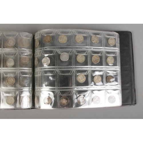 378 - A folder of British pre-decimal coins to include a good quantity of  approx. 38 silver three pence c... 