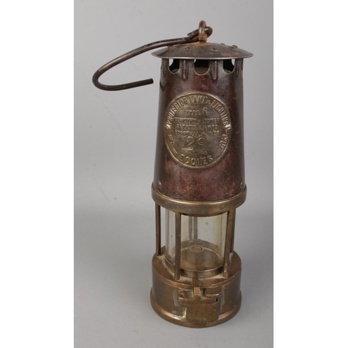 427 - An Eccles Type 6 miners safety lamp by the Protector Lamp and Lighting Co. Ltd. Stamped No. 29.