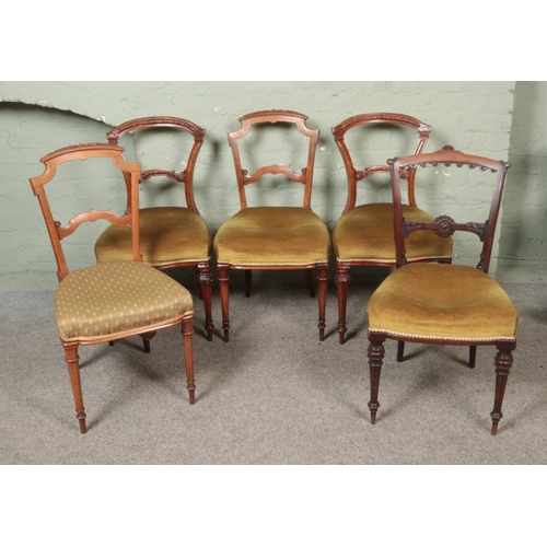 449 - A collection five of Victorian upholstered salon chairs each featuring floral carved backs. Comprise... 