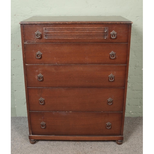 451 - A Butilux oak double wardrobe along with matching chest of six drawers. Both having linen fold decor... 