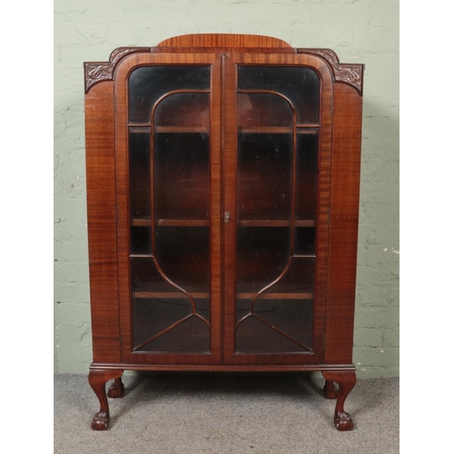 452 - A Sheard Binnington mahogany display cabinet raised on ball and claw supports.