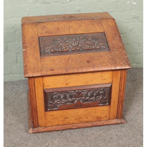 455 - An early 20th century boot/shoe box featuring carved floral panels to front and dated 1916. Approx. ... 