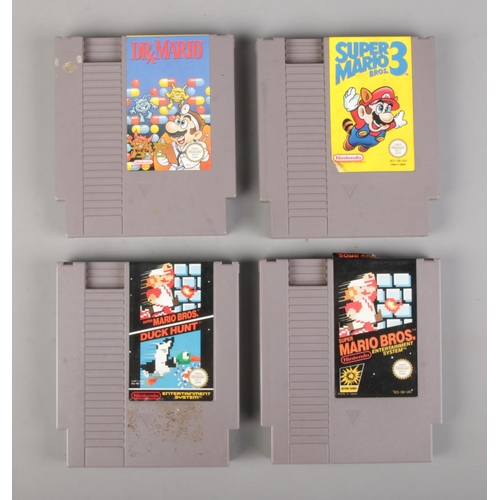 86 - Four Nintendo Entertainment System (NES) Mario related cartridges; Super Mario Bros. , Super Mario 3... 