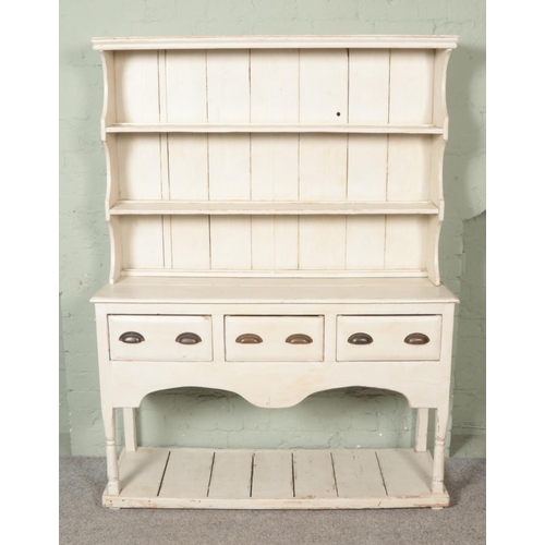 479 - A painted Georgian style dresser with two tier plate rack and three drawers over a pot board base 

... 