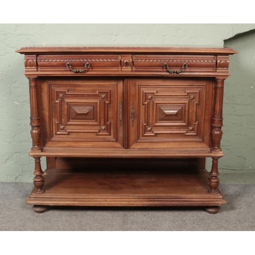 445 - A heavily carved marble topped French buffet sideboard featuring two drawers, cupboard and lower she... 