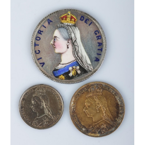 401 - Three Victorian enamelled silver coins; sixpence, shilling and halfcrown, all dated 1887.