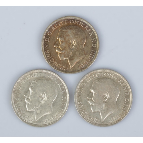 437 - Three George V silver florins; two dated 1916, one 1918.