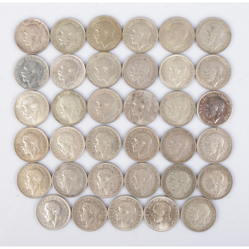 446 - Thirty five George V silver shillings. Consecutive run of dates from 1920-1936.