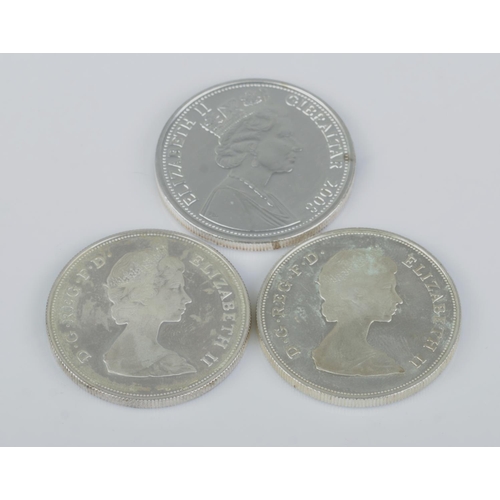 474 - Three Elizabeth II silver coins. Includes twenty five pence 1980 and 1981, and Gibraltar The Elizabe... 