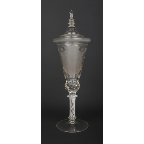 1 - A 19th century glass wine goblet and cover, possibly German. Having engraved armorial crest and flor... 