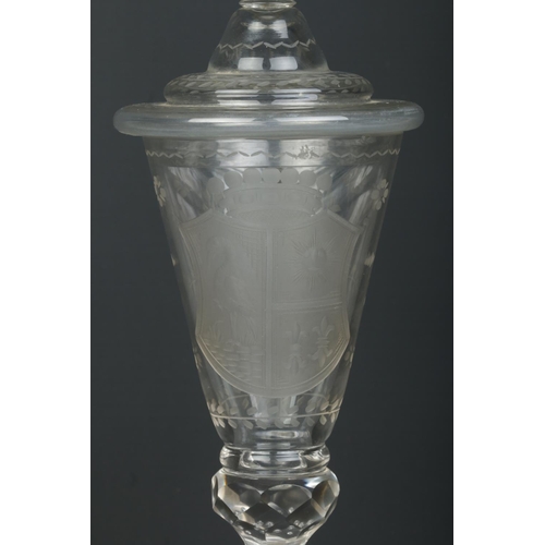 1 - A 19th century glass wine goblet and cover, possibly German. Having engraved armorial crest and flor... 