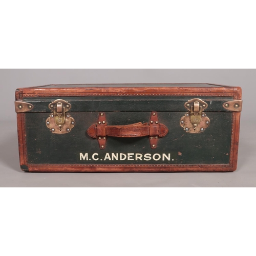 102 - A vintage French leather bound suitcase. Having canvas tray insert. The locks stamped Surete.