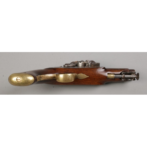 109 - An early 19th century flint lock pistol by Rigby, Dublin. Having brass trigger guard and pommel and ... 