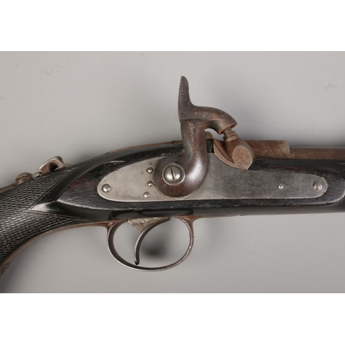 114 - A 19th century Westley Richards & Co monkey tail percussion rifle. Stamped with maker's name and dat... 