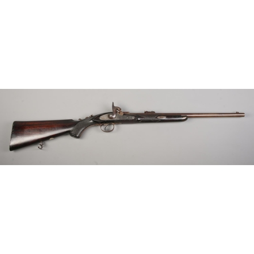 114 - A 19th century Westley Richards & Co monkey tail percussion rifle. Stamped with maker's name and dat... 