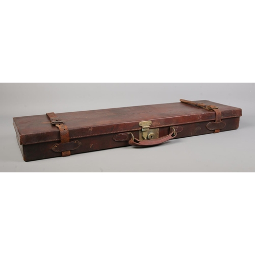 116 - A late 19th/early 20th century leather gun case by George Hinton & Sons. The top stamped for TE Bain... 