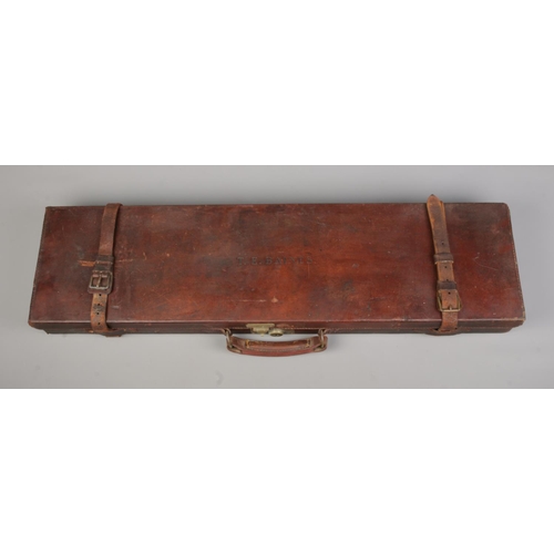 116 - A late 19th/early 20th century leather gun case by George Hinton & Sons. The top stamped for TE Bain... 