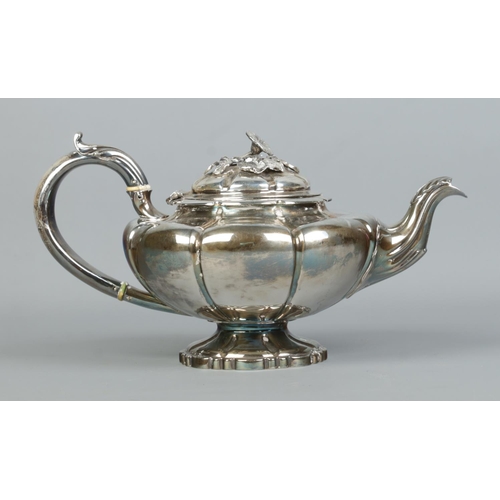 118 - A William IV silver teapot with floral finial. Assayed London 1836 by Edward Barton. 702g. Ivory Sub... 