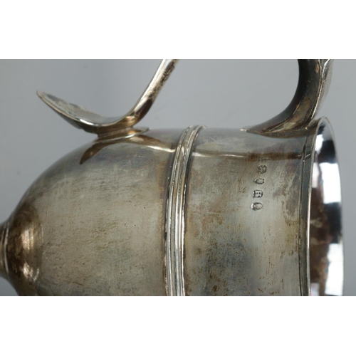 121 - A George III silver twin handled cup. Assayed London 1803 by Peter, Ann & William Bateman. Height 15... 