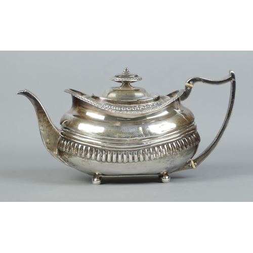 122 - A George III silver teapot raised on four ball feet. Cattle motifs to body. Assayed London 1815. 454... 