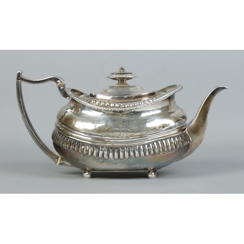 122 - A George III silver teapot raised on four ball feet. Cattle motifs to body. Assayed London 1815. 454... 