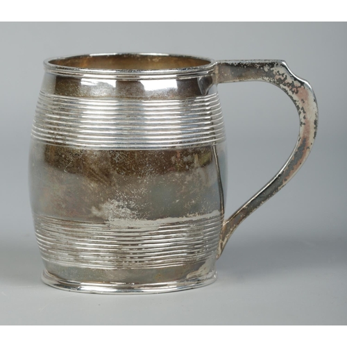 125 - A George III small silver barrel shaped cup with ribbed decoration. Assayed London 1802 by Peter, An... 