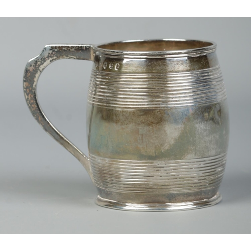 125 - A George III small silver barrel shaped cup with ribbed decoration. Assayed London 1802 by Peter, An... 