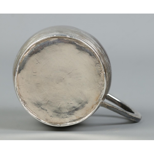 125 - A George III small silver barrel shaped cup with ribbed decoration. Assayed London 1802 by Peter, An... 