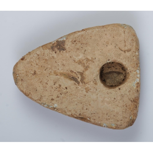 131 - A Medieval lead shield shaped trade weight, depicting a rampant lion. 3.5cm. 57.22g.