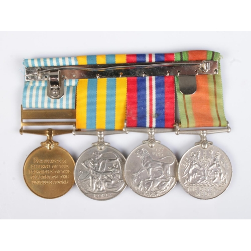 133 - A group of four military medals awarded to Private J Connolly, 14449789, Gloucestershire Regiment al... 