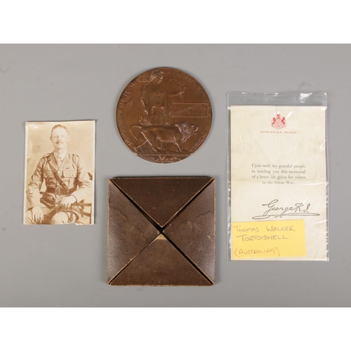 136 - A World War One death plaque for Thomas Walker Tortoishell, Australian Pioneers. With box, paper and... 