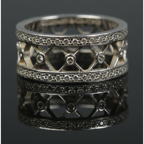 142 - A Tiffany & Co Voile platinum and diamond open band ring. Size K. Hallmarks for London 2006. 6.55g.